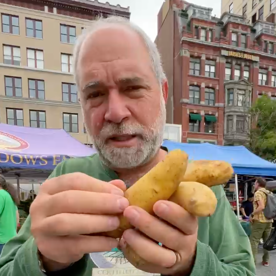 Zaid at Union Square green market with Norwich MEadows Farm Potatoes